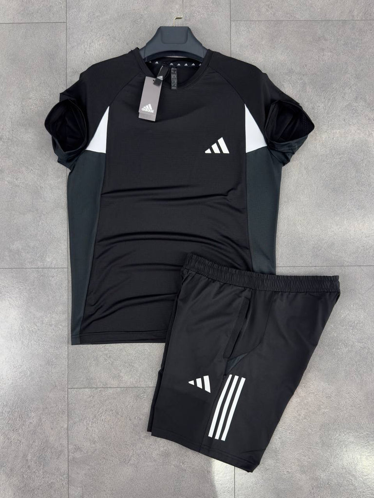 Set bărbătesc Adidas, format din pantaloni scurți și un tricou negru cu dungi albe. Calitate premium.