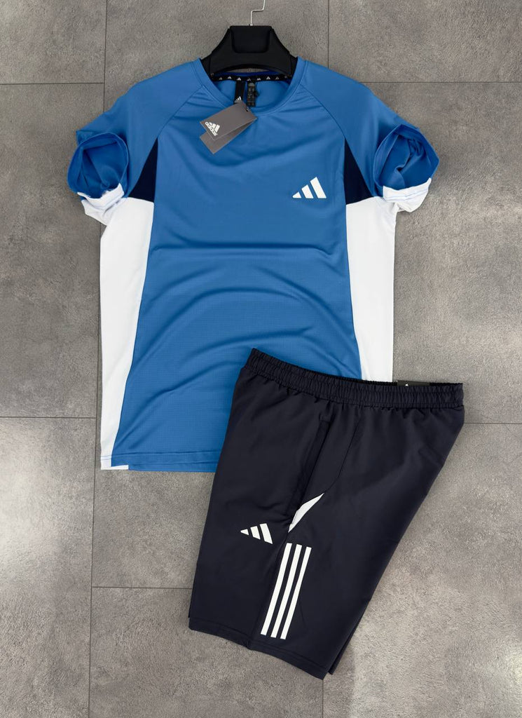 Set bărbătesc Adidas format din pantaloni scurți negri și un tricou albastru. Calitate premium.